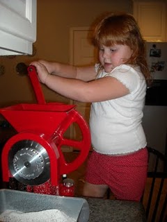 Little Girl Using GrainMaker Flour Mill